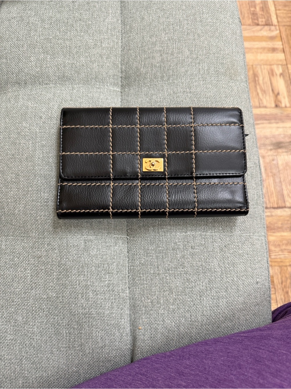 CHANEL Black Quilted Leather wallet with Brown Stitching and Gold CC Plaque